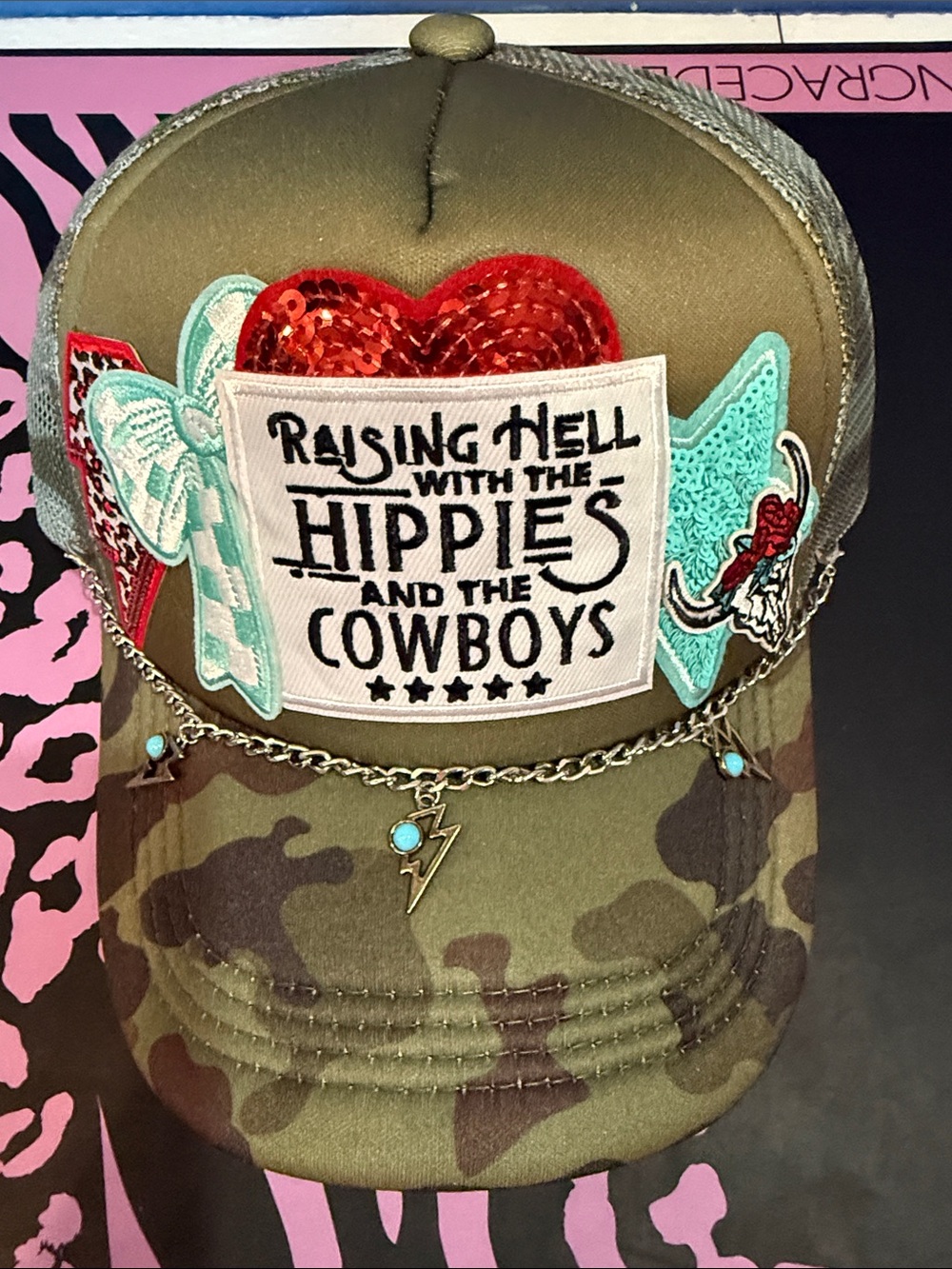 Raising Hell with the Hippies and the Cowboys Camouflage Trucker Hat